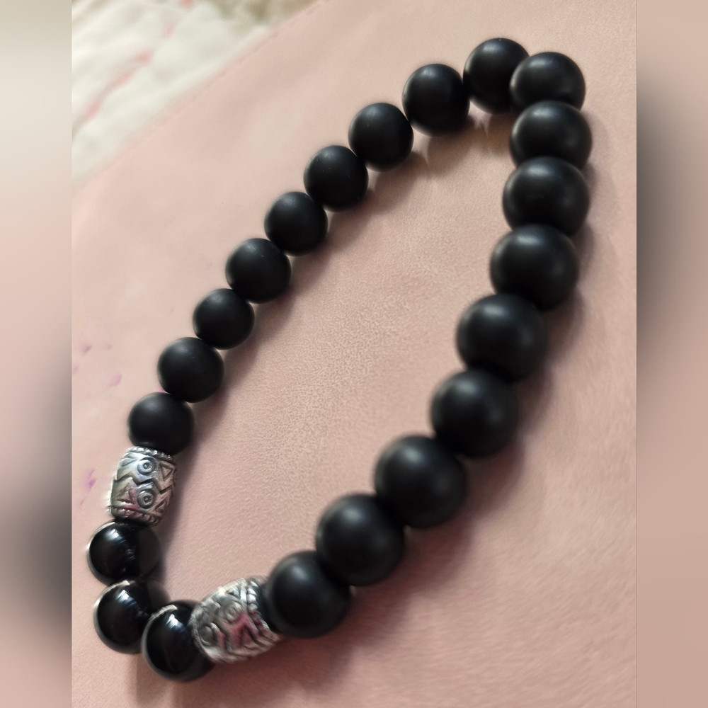 men's bracelet matte black onyx gemstones and decorative silver beads. 